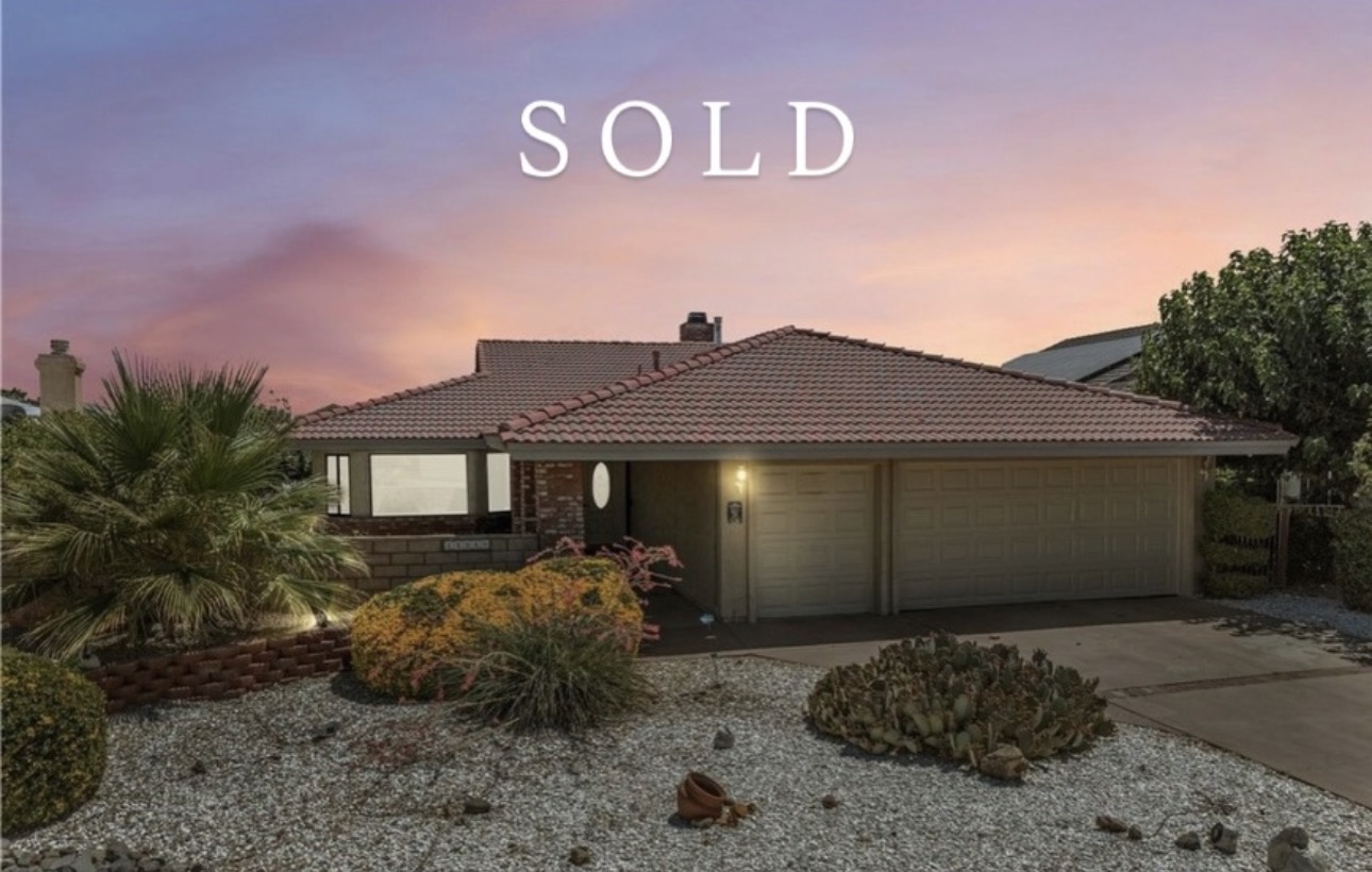 Sold single-story home photographed at sunset